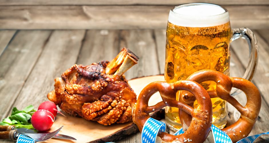 roasted pork knuckle with a pretzel and beer for Oktoberfest