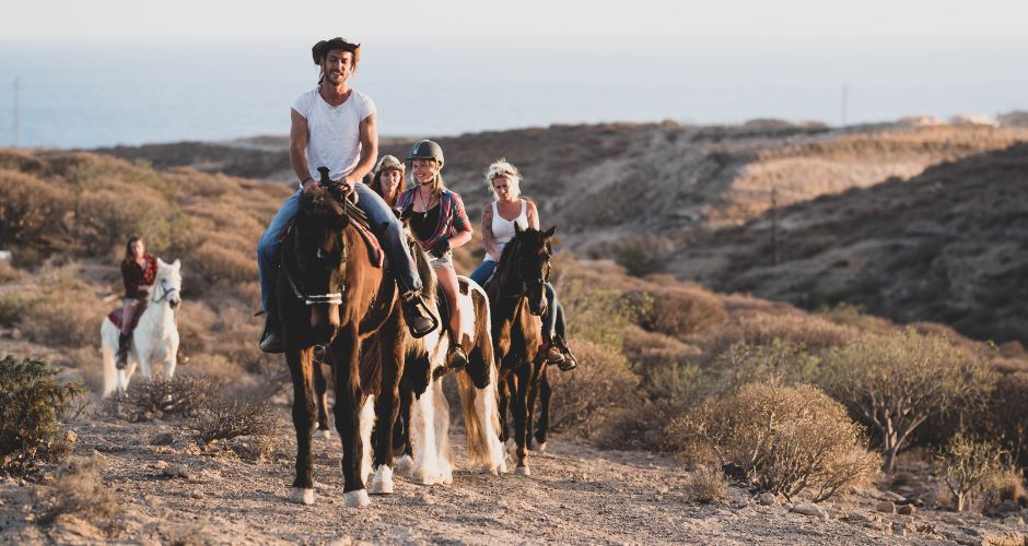 riding horses in the desert