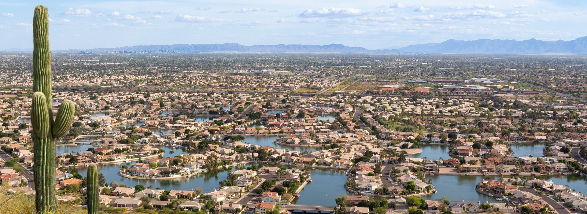 Panoramic view of Glendale, Arizona, showcasing a suburban landscape with terracotta-roofed houses.